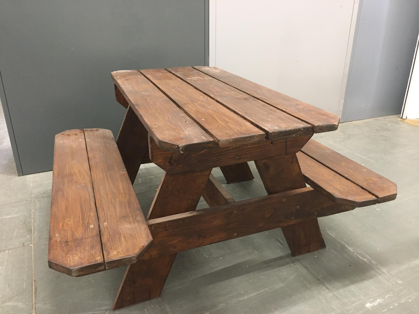 Solid timber picnic table with integrated benches